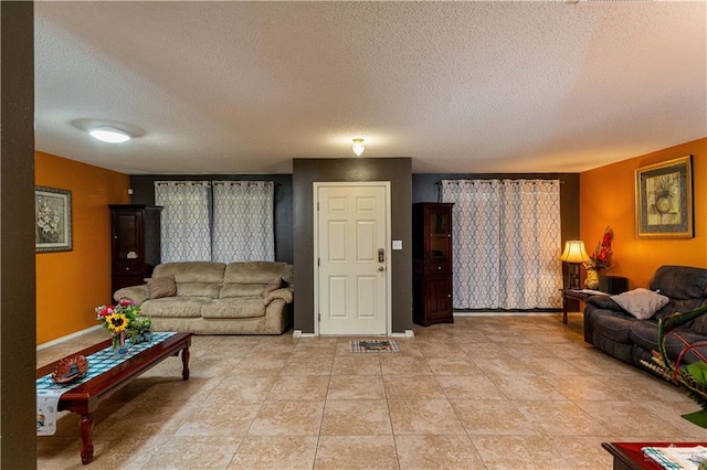 tiled living room with a textured ceiling