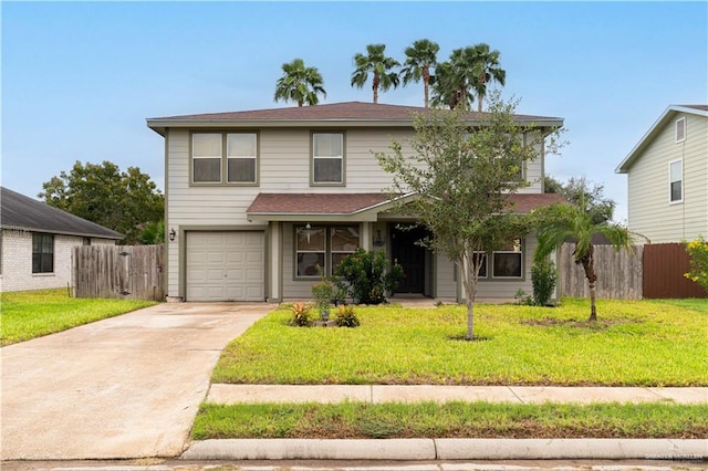 view of property featuring a garage and a front lawn