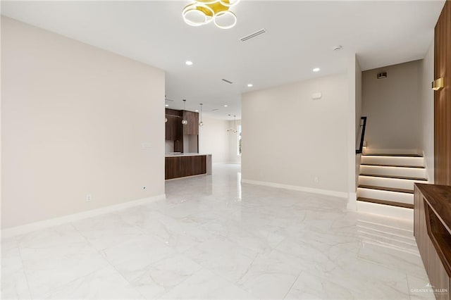spare room featuring recessed lighting, stairway, visible vents, and marble finish floor