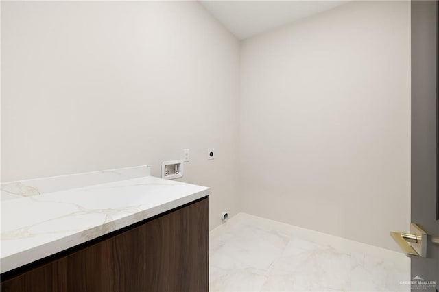 clothes washing area featuring laundry area, electric dryer hookup, baseboards, hookup for a washing machine, and marble finish floor
