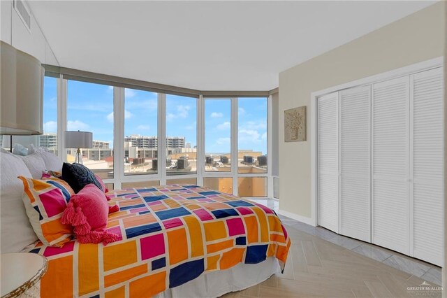 334 Padre Blvd Unit 801, South Padre Island, TX 78597 - bedroom featuring a view of city and a closet