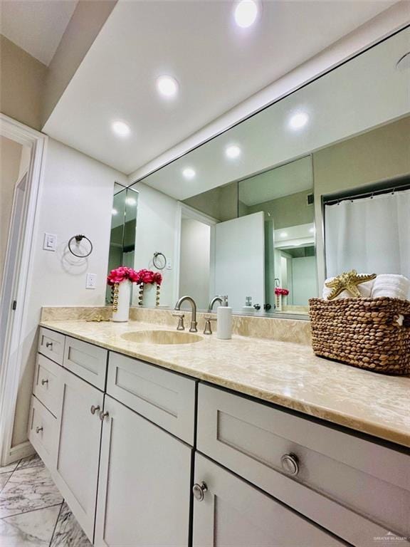 334 Padre Blvd Unit 801, South Padre Island, TX 78597 - bathroom featuring marble finish floors, vanity, and recessed lighting
