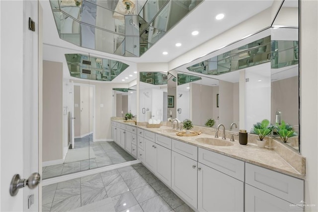 334 Padre Blvd Unit 801, South Padre Island, TX 78597 - bathroom with marble finish floors, baseboards, double vanity, and recessed lighting