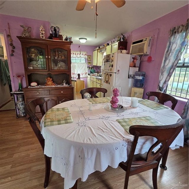 16073 S US Highway 281, San Benito, TX 78586 - dining space featuring plenty of natural light, a wall unit AC, and light wood-style flooring