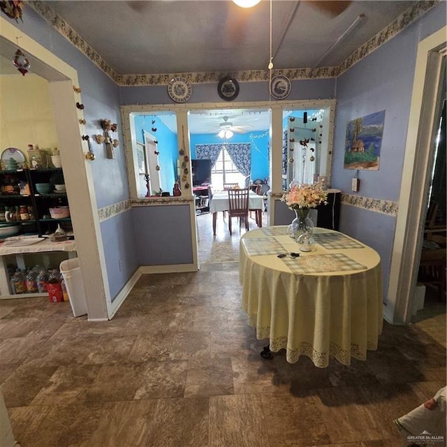 16073 S US Highway 281, San Benito, TX 78586 - dining room featuring ceiling fan and stone finish floors