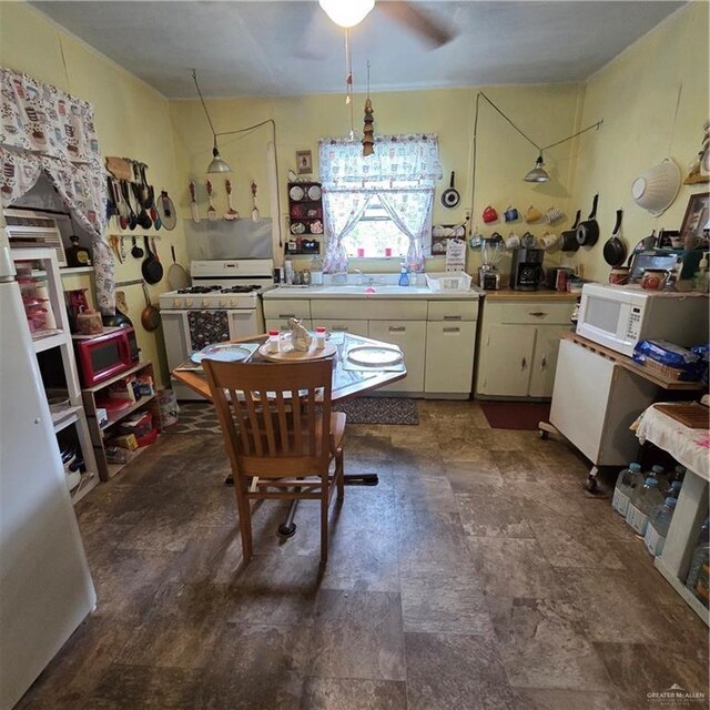 16073 S US Highway 281, San Benito, TX 78586 - kitchen featuring white appliances, a ceiling fan, light countertops, and white cabinetry