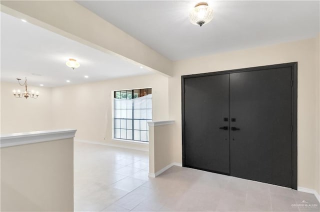 413 W Jonquil Ave, Mcallen, TX 78501 - foyer entrance featuring baseboards, light tile patterned floors, a chandelier, and recessed lighting