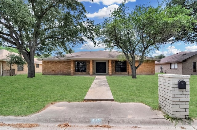 413 W Jonquil Ave, Mcallen, TX 78501 - single story home featuring a front yard and brick siding