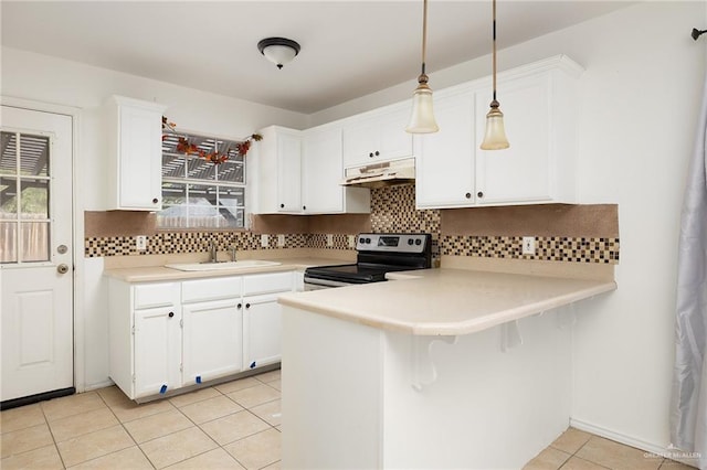 kitchen with kitchen peninsula, pendant lighting, white cabinets, stainless steel range with electric cooktop, and light tile patterned flooring