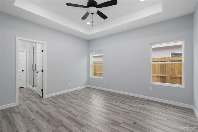 2023 Peace Dr, La Feria, TX 78559 - spare room with a raised ceiling, a ceiling fan, wood finished floors, and recessed lighting