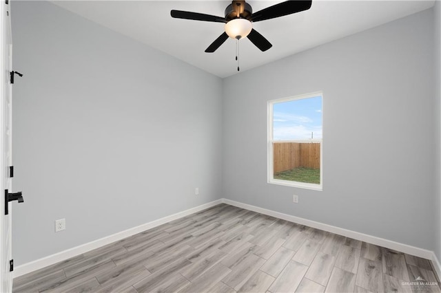 2023 Peace Dr, La Feria, TX 78559 - spare room with light wood-type flooring, baseboards, and ceiling fan