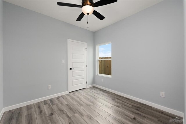 2023 Peace Dr, La Feria, TX 78559 - empty room featuring wood finished floors, baseboards, and a ceiling fan
