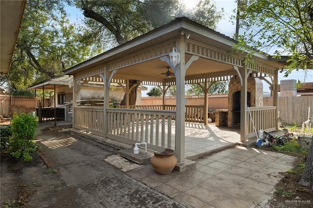 view of patio with a gazebo and ceiling fan