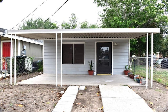 view of front of home featuring fence