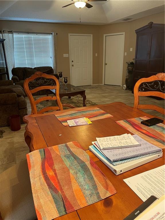 dining room with ceiling fan