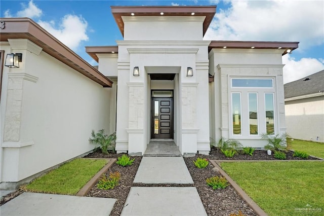 entrance to property with a yard