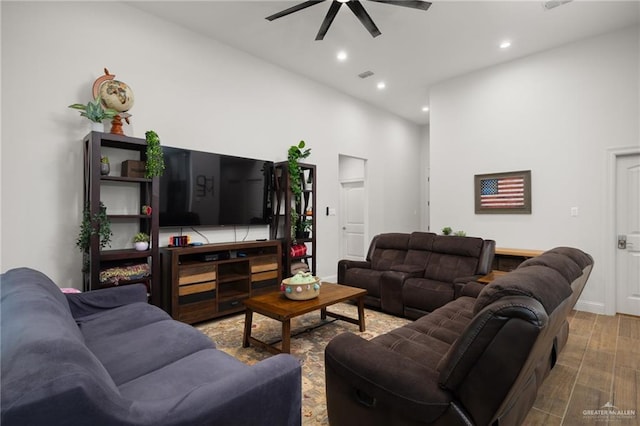 living room with ceiling fan and wood-type flooring