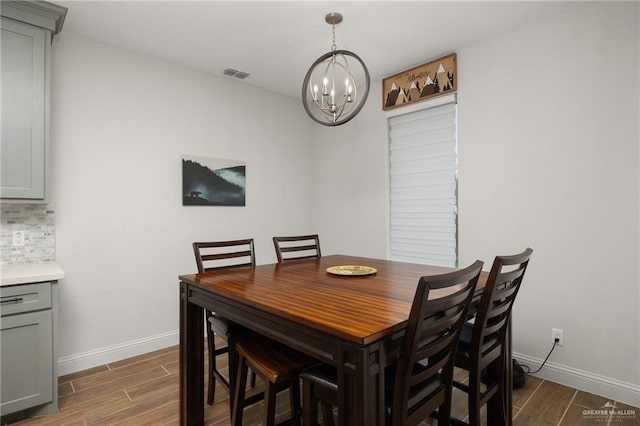 dining area featuring a notable chandelier