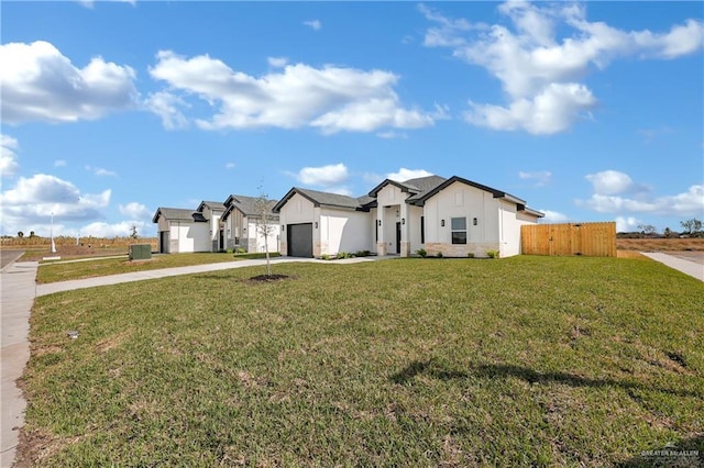 modern farmhouse style home featuring concrete driveway, an attached garage, fence, cooling unit, and a front lawn