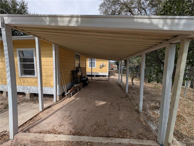 view of parking / parking lot with a carport