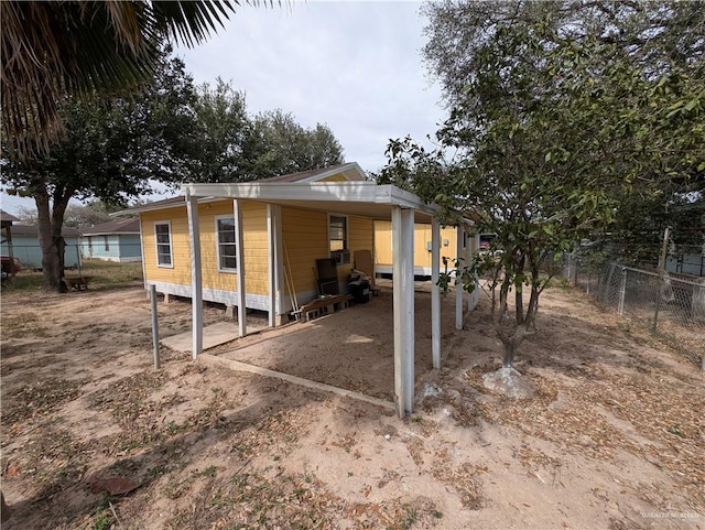 exterior space with a carport