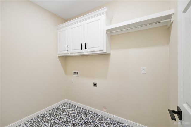 laundry area featuring hookup for an electric dryer, cabinets, and hookup for a washing machine