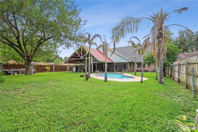 view of yard with a fenced in pool and a fenced backyard