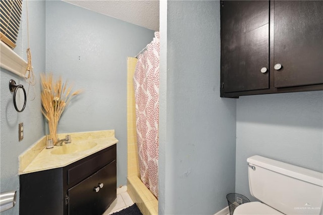 bathroom with vanity, curtained shower, and toilet