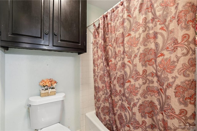 bathroom with toilet and shower / tub combo