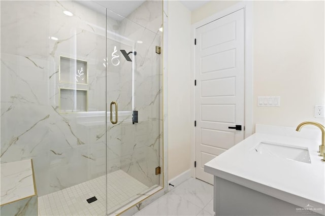 bathroom featuring vanity and a shower with door