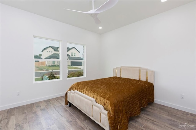 bedroom featuring hardwood / wood-style flooring and ceiling fan