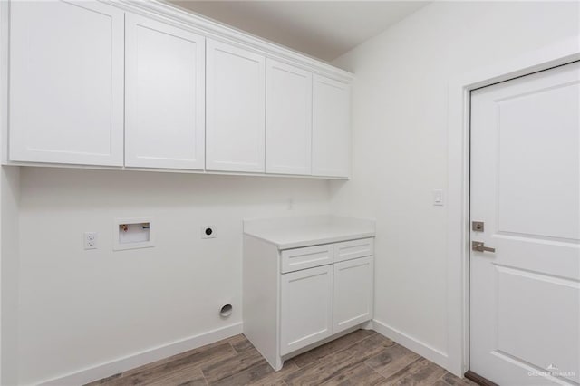 washroom featuring cabinets, wood-type flooring, hookup for a washing machine, and electric dryer hookup