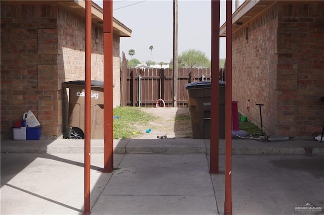 view of patio featuring fence