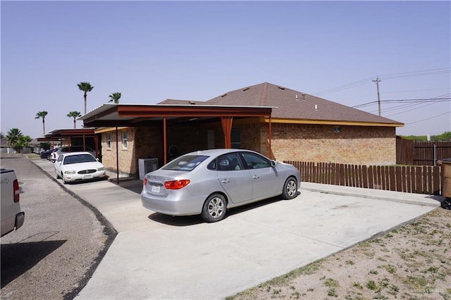 view of front of home with fence and brick siding