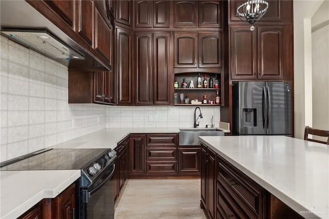 kitchen with sink, stainless steel fridge with ice dispenser, black / electric stove, decorative backsplash, and custom range hood