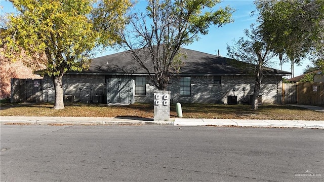 single story home featuring central AC unit