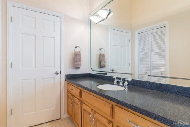 bathroom with tile patterned flooring and vanity