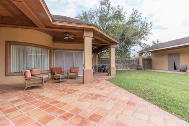 view of patio / terrace featuring ceiling fan