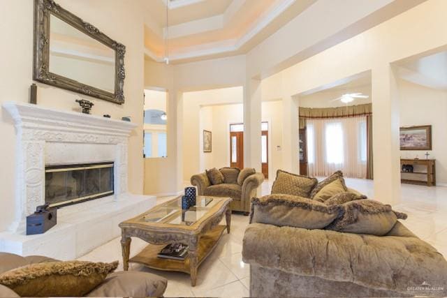 living room with ceiling fan and light tile patterned floors