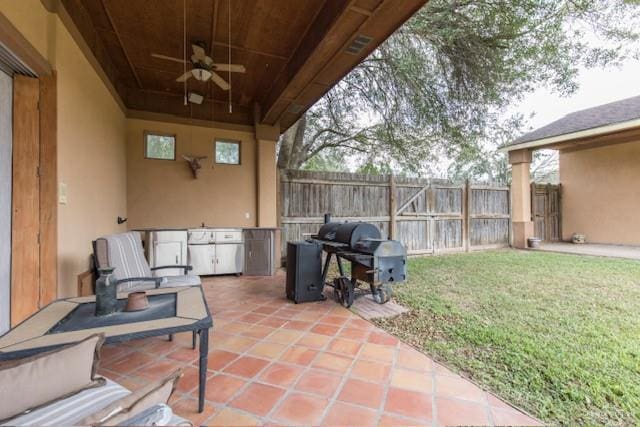 view of patio / terrace featuring ceiling fan and grilling area