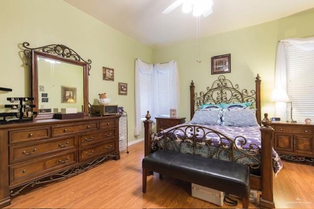 bedroom with ceiling fan and light hardwood / wood-style flooring