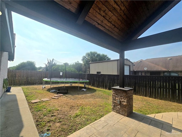 1511 Oak Dr, Mission, TX 78572 - view of yard with a trampoline and a patio area