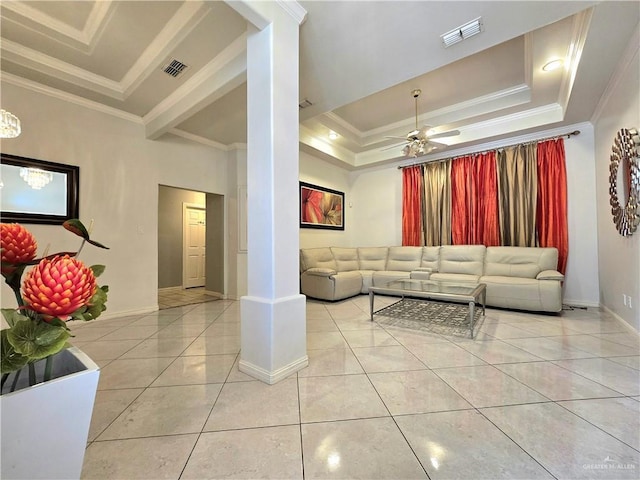 1511 Oak Dr, Mission, TX 78572 - living room with ornamental molding, a tray ceiling, light tile patterned flooring, baseboards, and ornate columns