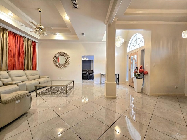 1511 Oak Dr, Mission, TX 78572 - living room featuring a tray ceiling, ornate columns, ornamental molding, ceiling fan, and light tile patterned floors