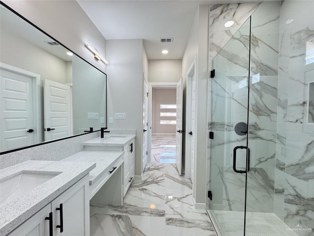 bathroom featuring vanity and a shower with shower door