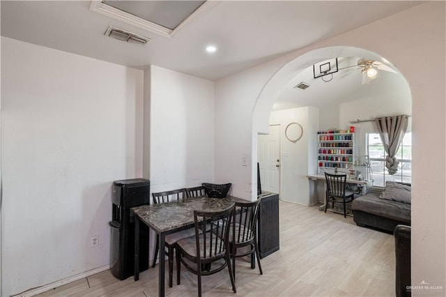 dining space featuring ceiling fan and light wood-type flooring