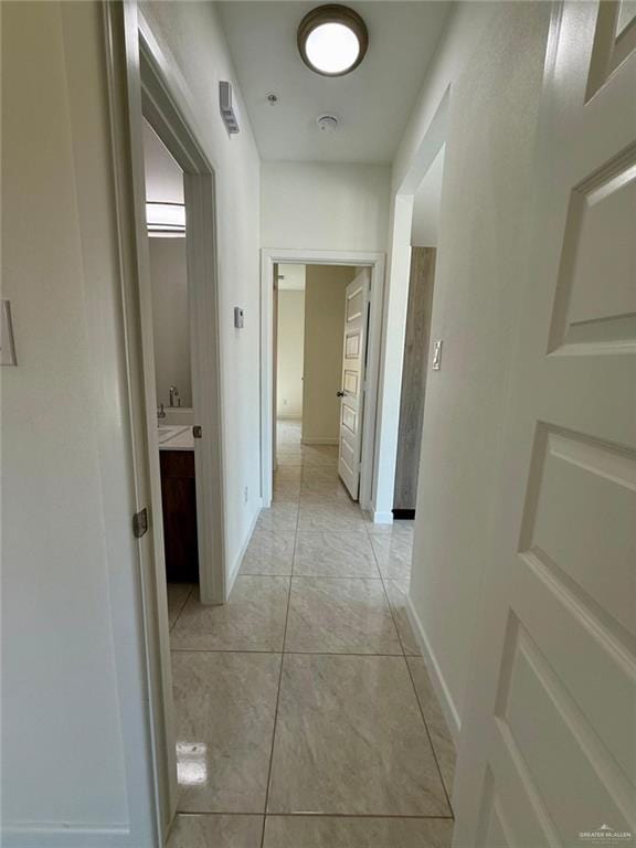 5325 Vision St, Rio Grande City, TX 78582 - corridor with light tile patterned floors and baseboards