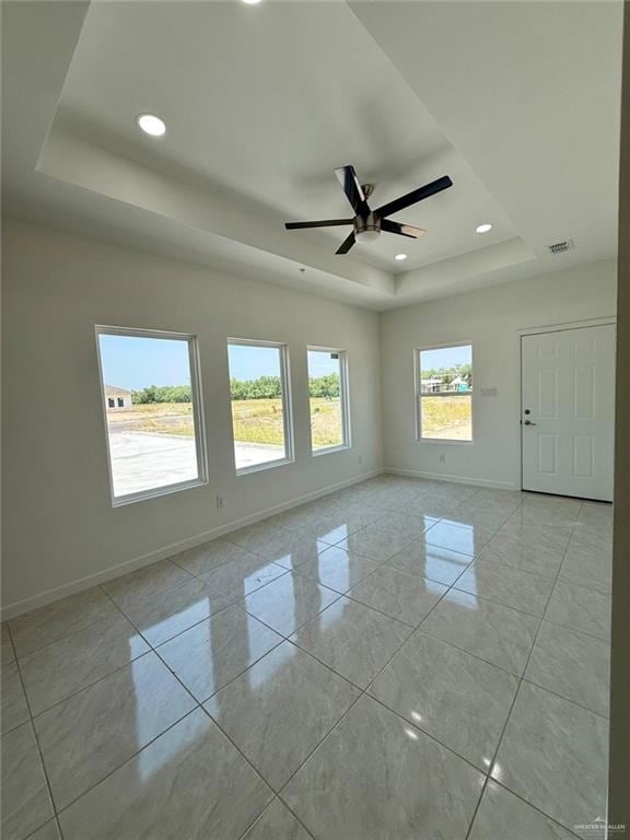 5325 Vision St, Rio Grande City, TX 78582 - spare room featuring a raised ceiling, baseboards, ceiling fan, recessed lighting, and light tile patterned floors