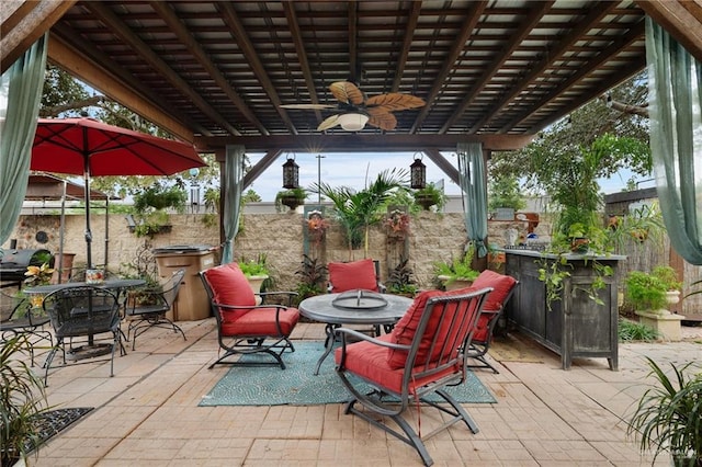 view of patio featuring ceiling fan and a pergola