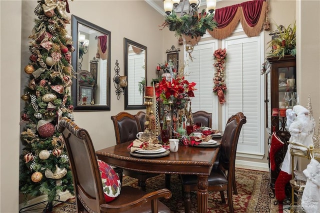 dining space featuring ornamental molding